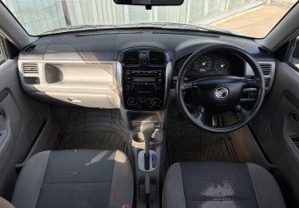 Подержанный автомобиль Mazda Demio 2002 года (9 фото)