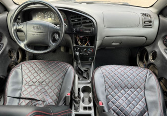 Подержанный автомобиль Kia Spectra Sedan 2008 года (10 фото)